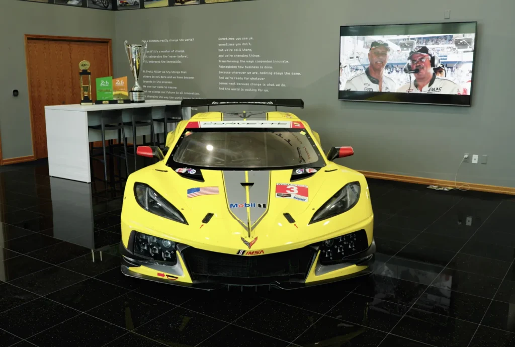 C8.R Corvette parked in the lobby of Pratt Miller Motorsports.