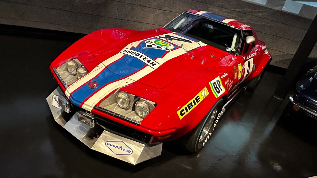 On display at the National Corvette Museum in Bowling Green, the No. 4 BP/Goodyear C3 isn’t just a pretty red race car—it’s a survivor from one of Corvette’s boldest experiments. Fielded by the privateer Race Engineering & Development (R.E.D.) team, this car carried Goodyear’s then-new radial tires into the 1972 24 Hours of Le Mans, proving that a production-based Corvette could take the fight to Europe while doubling as a rolling tire test bed. Its story underscores how Corvette wasn’t merely chasing trophies; it was helping evolve the technology that would shape street cars for decades. Standing next to the car at the Museum, you can see the purposeful aero, the battle-ready stance, and the period sponsor graphics up close—details that photos just can’t capture. For anyone who loves Corvette Racing history, a trip to Bowling Green to see No. 4 in person is absolutely bucket-list material. (Image courtesy of the author)