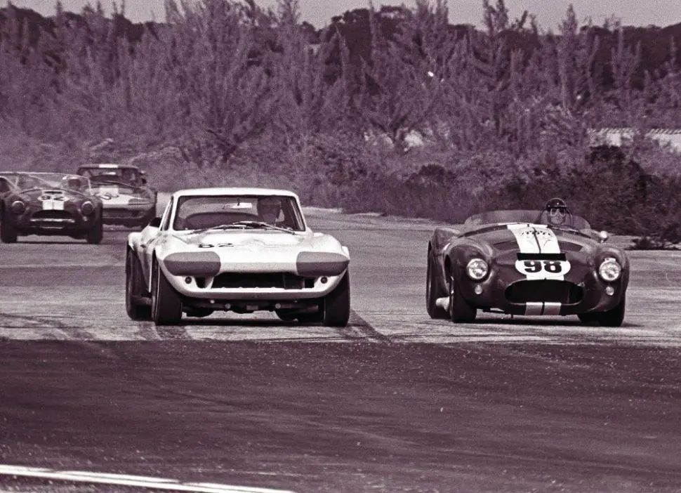 Zora Arkus-Duntov pushed for the Corvette Grand Sport because he understood that the car’s greatest threat was no longer theoretical—it was already winning races. Carroll Shelby’s Cobra, with its brutal power-to-weight advantage and proven track record, exposed the limits of the production-based Corvette in international GT competition. Duntov’s answer was not incremental improvement but a clean break: a purpose-built, ultra-lightweight Corvette engineered specifically to neutralize the Cobra on equal terms. By stripping hundreds of pounds from the chassis, widening the track, and pairing the car with high-output small-block power, the Grand Sport was conceived as a direct counterpunch to Shelby’s Anglo-American hybrid. It was meant to restore Corvette’s credibility at the highest levels of sports car racing, particularly in FIA GT and endurance events. In Duntov’s mind, the Grand Sport was not a rebellion—it was a necessary evolution to ensure the Corvette could fight, and win, against the Cobra on the world stage. (Image courtesy of GM Media LLC)