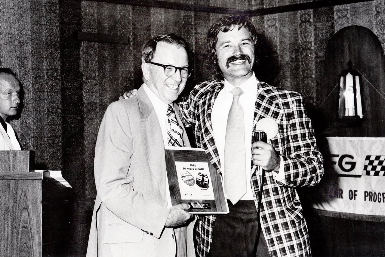 This photo captures Robert S. Morrison (center) —founder of Molded Fiber Glass (MFG)—being honored for his company’s 20 years of innovation in 1975. Morrison’s vision and persistence had been pivotal more than two decades earlier when he convinced General Motors that fiberglass could be used for automobile production, a radical idea at the time. His Ashtabula, Ohio firm supplied the Corvette’s body panels in 1953–54, making the Corvette the first mass-produced car with a fiberglass body. Here, smiling with son Richard, Morrison is celebrated not just for his company’s longevity but for his role in shaping the very foundation of America’s sports car. (Image courtesy of richardmorrisonmfg.com)