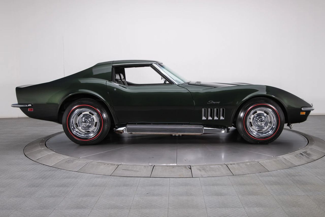 RPO N14 was the factory Side-Mount Exhaust System—those long, finned/covered pipes running beneath the doors—that gave the ’69 Corvette its most extroverted look and sound. The setup routed the dual exhaust to side outlets with heat-shielded covers, trimming backpressure for big-block breathing while delivering a hard, unmistakable bark right at curbside. Rare, dramatic, and functional, N14 turned any Stingray into a rolling showpiece before you even cracked the throttle. (Image courtesy of RK Motors)
