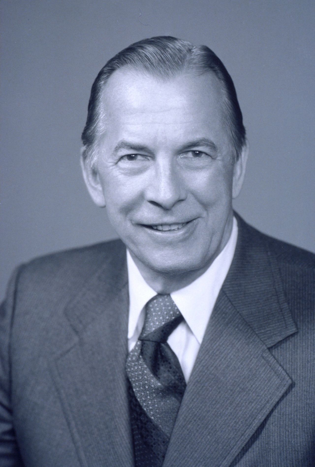 Edward N. “Ed” Cole was the engineer-turned-executive who had to slam the brakes on GM’s horsepower wars. As president of General Motors from 1967 to 1974, he found himself steering the company straight into the headwinds of looming emissions rules and the coming switch to unleaded fuel. Wikipedia +1  In early 1970, Cole issued a now-famous mandate: beginning with the 1971 model year, every GM engine would be able to run on roughly 91-octane, low-lead fuel, which meant across-the-board cuts in compression ratios and, inevitably, a sharp drop in advertised horsepower. Hemmings +4 Hobby Car Corvettes +4 The Lost Corvettes +4  Muscle-car fans saw it as the day the party ended, but Cole’s edict also positioned GM to survive the 1970s—ready for catalytic converters, cleaner exhaust, and a very different performance landscape. (Image courtesy of GM Media LLC)