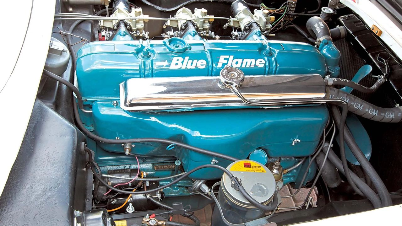 The heart of the 1953–1954 Corvette was Chevrolet’s 235-cubic-inch “Blue Flame” inline-six. Though rooted in a passenger-car powerplant, it was heavily reworked for Corvette duty, featuring a higher-lift camshaft, solid lifters, and a trio of Carter side-draft carburetors. Officially rated at 150 horsepower, the Blue Flame was paired exclusively with a two-speed Powerglide automatic—a reflection of GM’s belief that Corvette was more boulevard cruiser than sports car. While later eclipsed by small-block V8 power, the Blue Flame remains historically significant as the Corvette’s first engine, giving America’s sports car its inaugural voice.