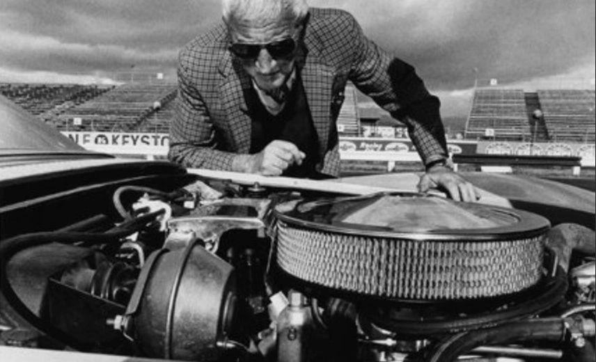 Duntov may have posed proudly with the LS6, but he was no blind cheerleader for brute force. He knew this 454 was born in compromise—a detuned version of the cancelled LS7, its output muffled by quiet exhaust and tightening emissions rules just as things were getting interesting. As a chassis man at heart, he also understood what all that iron over the front axle did to the car’s balance, and he’d long favored lighter, high-winding small-blocks for truly world-class handling. So the LS6 embodied a tension Duntov wrestled with constantly: the desire to give Corvette buyers all the horsepower they craved, while watching the regulatory vise tighten and knowing that, dynamically, the car would always be better if weight and complexity went the other way.