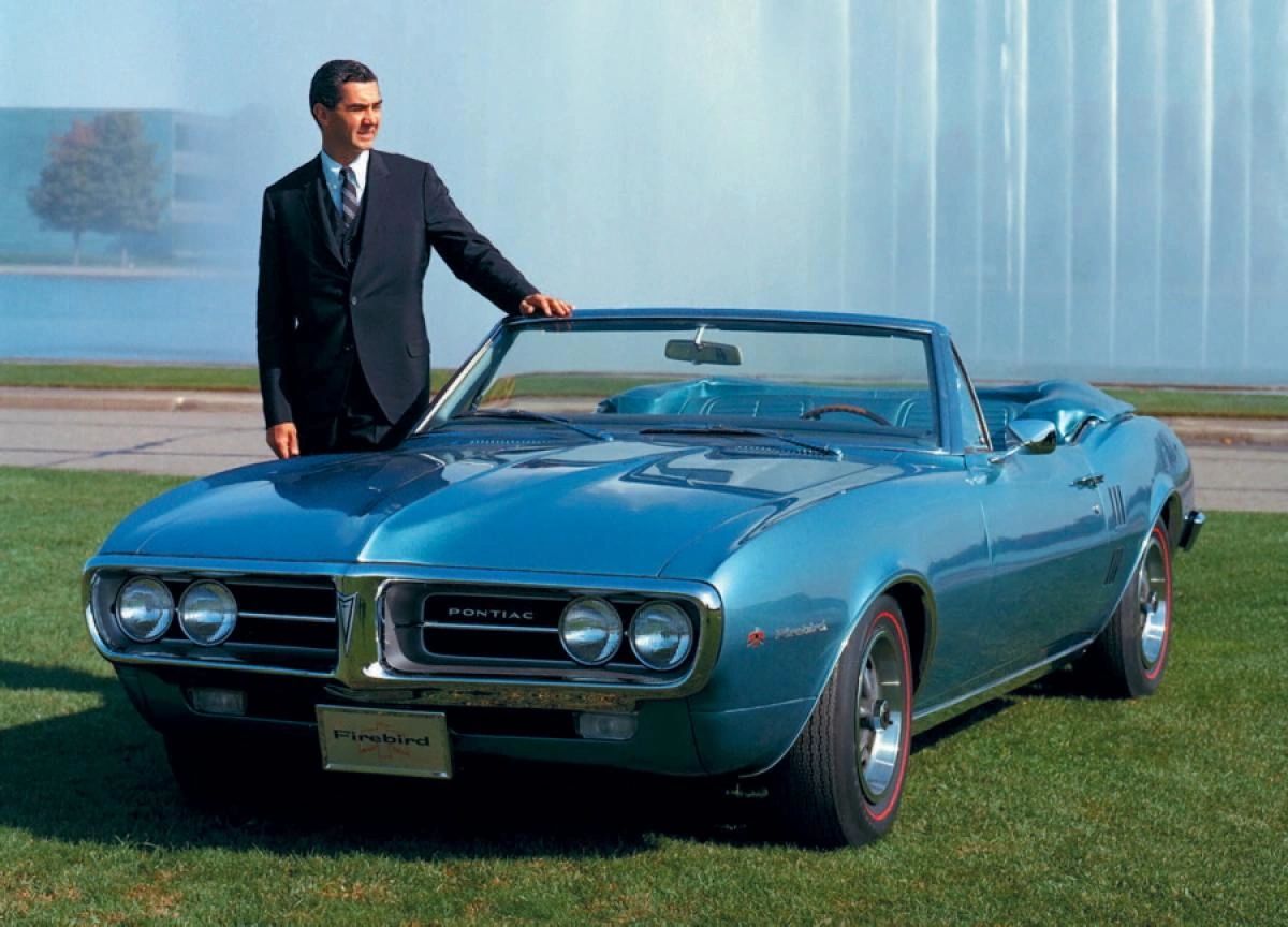 John Z. DeLorean stood beside the 1967 Pontiac Firebird—a car that, like the third-generation Corvette he helped influence, embodied the bold, expressive spirit sweeping through GM Design in the late 1960s. As head of Pontiac, DeLorean was part of the internal push toward more aggressive, performance-oriented styling and engineering across GM’s divisions. His advocacy for lightweight materials, advanced suspensions, and driver-focused design resonated with Corvette engineers like Zora Arkus-Duntov and designers under Bill Mitchell. That philosophy helped shape the C3 Corvette’s fusion of power and sophistication—its long, sensuous lines, forward-leaning stance, and unapologetic emphasis on performance all echoed DeLorean’s belief that a sports car should stir the soul as much as it commands the road. (Image courtesy of GM Media LLC)
