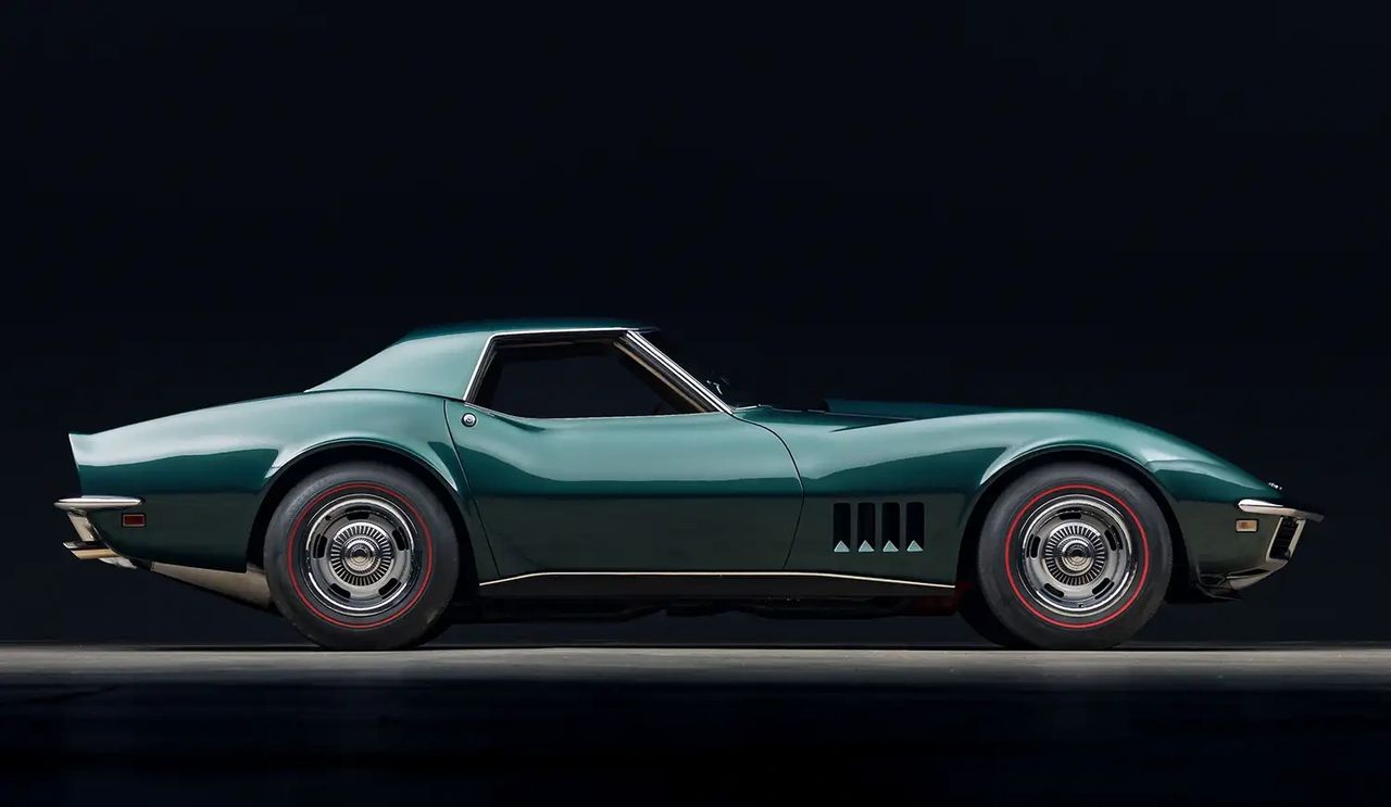The 1968 Corvette L88 is the C3 at its most purpose-built—a competition-spec 427 sold only just street-legal enough to qualify. Aluminum heads, a radical solid-lifter cam, 12.5:1 compression, big Holley carb and heavy-duty cooling made real power far beyond the conservative 430-hp rating (on race fuel, well over 500 hp). Ordering L88 automatically brought the serious gear—M22 close-ratio 4-speed, Positraction, heavy-duty brakes and suspension—while deleting comfort items like the radio and heater, and a console decal warned to use high-octane fuel only. Just 80 were built for 1968, yet cars like the Owens-Corning entries proved the package immediately on track in SCCA A-Production. The result: the L88 turned the new shark-body Corvette from bold styling into a bona fide front-running competition car.