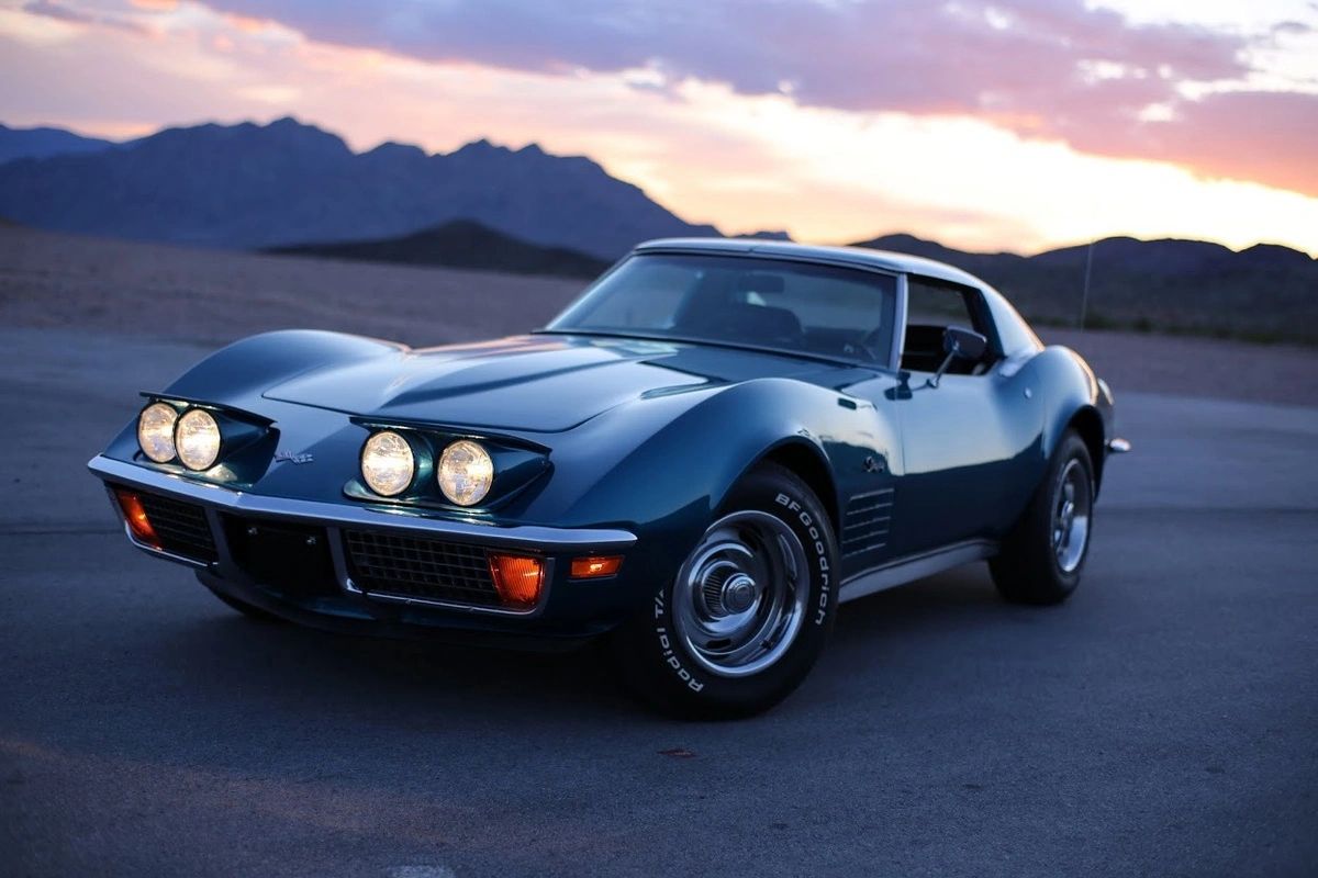 As the sun drops behind the mountains, this ’72 Corvette feels like the last bright glow of an era that’s about to slip below the horizon. Its chrome bumpers, exposed headlights, and unfiltered small-block attitude represent the final, unbroken line back to the raw, late-’60s Stingray. Within a year, impact standards, emissions rules, and a softer, federally-minded 1973 facelift would begin reshaping Corvette’s face and character. This image is that quiet moment in between—a farewell to what was, and a subtle hint that the long twilight of the classic muscle era had already begun.