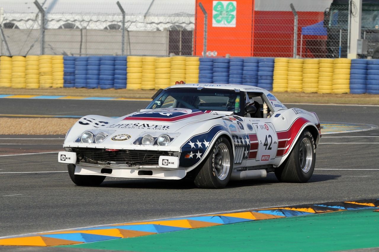 The 1968 L88 race car distilled the new C3 into a purpose-built contender: a high-compression 427 with aluminum heads and a solid-lifter cam breathing through cold-air induction, conservatively rated at 430 hp but capable of far more on race fuel. Chevrolet bundled the essentials—M22 close-ratio 4-speed, heavy-duty cooling and brakes, Positraction—and left out the luxuries, creating a turnkey foundation for privateers. Teams like Owens-Corning Fiberglas (Tony DeLorenzo/Jerry Thompson) proved the package in SCCA A-Production, while American outfits carried the L88 formula into endurance arenas, including FIA events and Le Mans, where wide flares, side pipes, and big rubber showed how far the platform could be pushed. The result was a car that matched the C3’s dramatic shape with credible speed and durability, cementing the L88 as the era’s definitive racing Corvette.