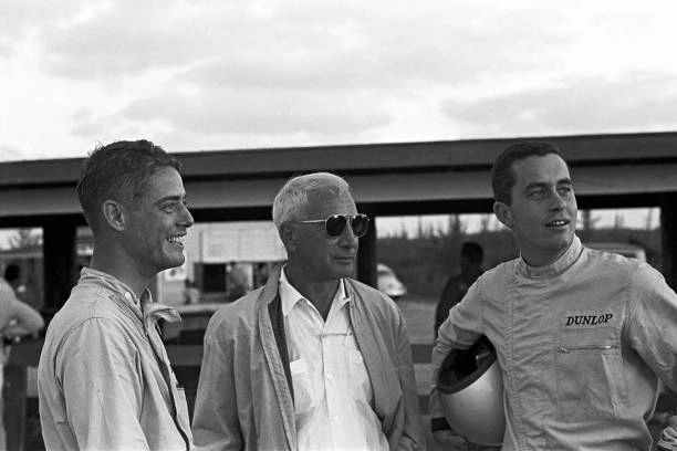 This image captures Zora Arkus-Duntov in his element at Nassau—working the edges of Chevrolet’s no-racing posture by leaning on trusted drivers to put the Grand Sport through real competition. At his side are Roger Penske and Jim Hall, two of the sharpest minds behind the wheel, both capable of translating lap-time into actionable engineering feedback. With the factory unable to publicly support the program, Duntov used privateer participation as his field-test strategy: race the cars, observe the weaknesses, and learn what no controlled test session could reveal. These weren’t casual paddock conversations—they were the quiet mechanics of development happening in plain sight. It’s a snapshot of how the Grand Sport kept evolving even after official support was cut off: through drivers, data, and Duntov’s refusal to let the idea die.