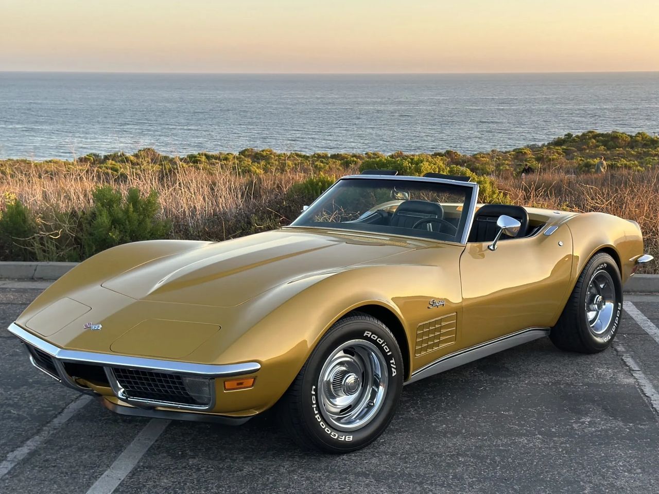 The 1971 Corvette sits at a quiet turning point in the brand’s history—a chrome-bumper Stingray that still looks every inch the late-’60s street fighter, but is already adapting to a new era of unleaded fuel, emissions rules, and Ed Cole’s corporate horsepower edict. Compression ratios fell and net ratings replaced the old gross numbers, yet cars like this still offered big-block torque, four-speed gearboxes, and the kind of long-hood, short-deck stance that had made Corvette an American icon. It’s the moment where Chevrolet begins trading outright spec-sheet bravado for a more nuanced balance of performance, drivability, and survivability in a changing world, such as the War Bonnet Yellow example seen here—a vivid reminder that even in a time of tightening regulations, Corvette refused to stop looking and feeling special. (Image courtesy of bringatrailer.com)