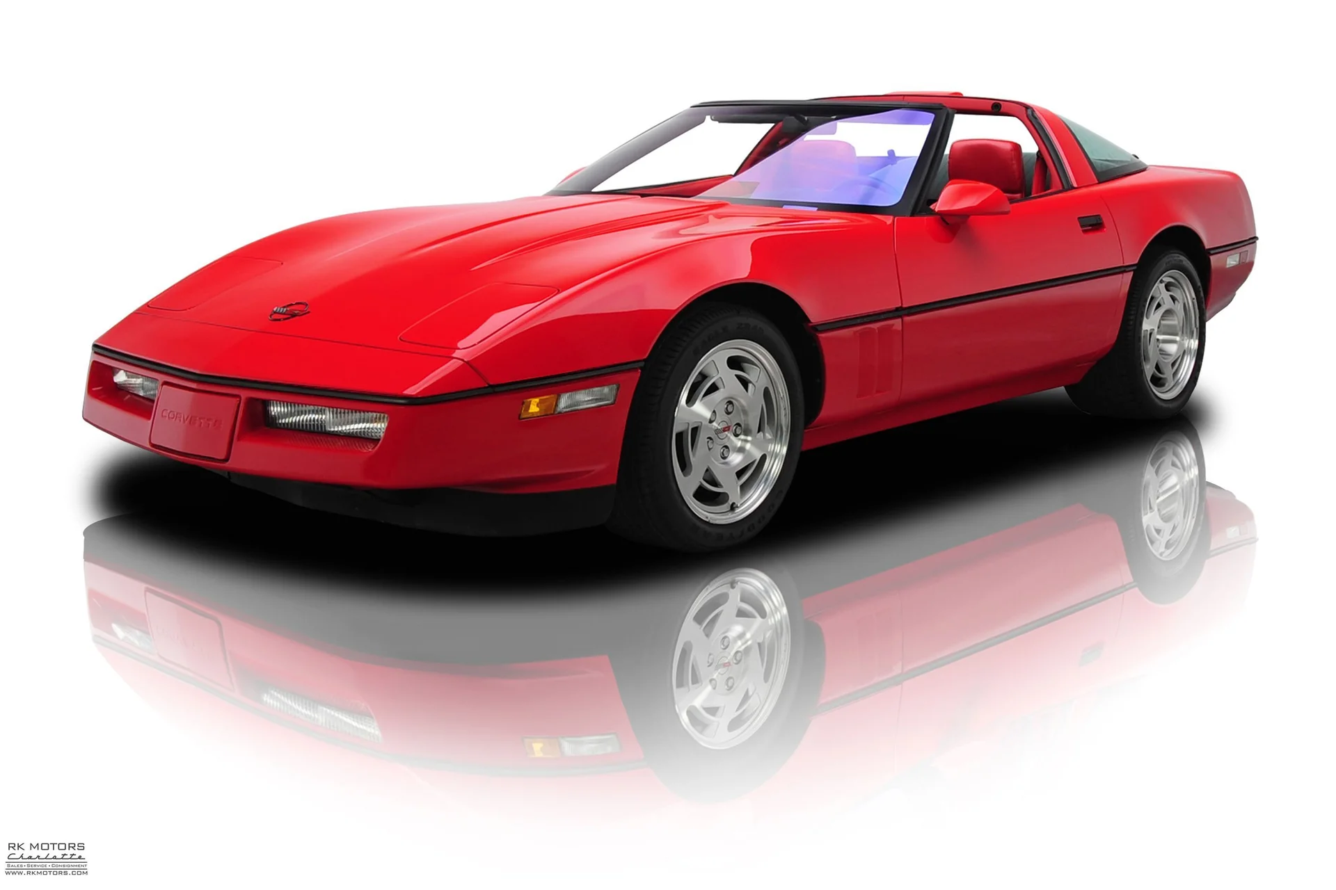 1990 Chevrolet Corvette in red.