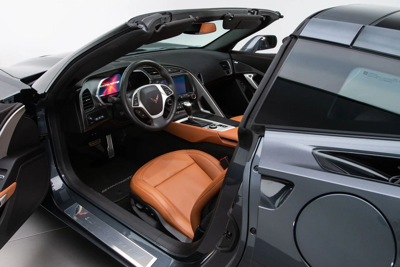 The C7 cabin finally felt world-class. Chevy wrapped the interior—stitched leather, real metal, and optional carbon fiber replaced the old molded plastics—while the driver-canted console and grab-bar gave the cockpit a purposeful, twin-cockpit look. (Image courtesy of RK Motors)