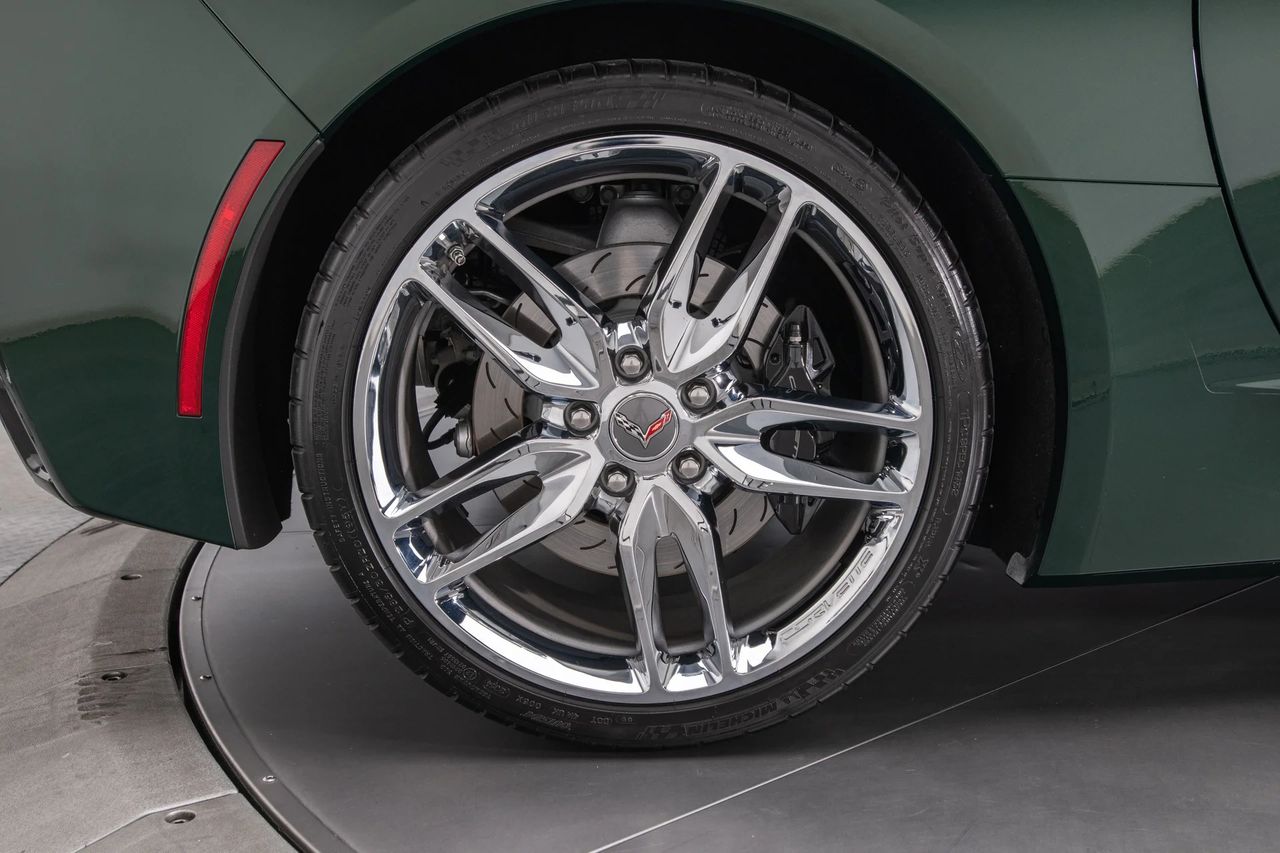 Polished split-spoke wheels framed the C7’s Brembo hardware nicely—behind them you can see the slotted rotors and fixed four-piston calipers that delivered the car’s confident, repeatable stops. Many Z51 cars were fitted with black calipers, but color alone didn’t prove the package; the telltales were the larger, two-piece rotors and Z51-specific brake sizing. Paired with Michelin Pilot Super Sport ZP rubber, the setup looked premium and braked like it meant it. (Image courtesy of RK Motors)