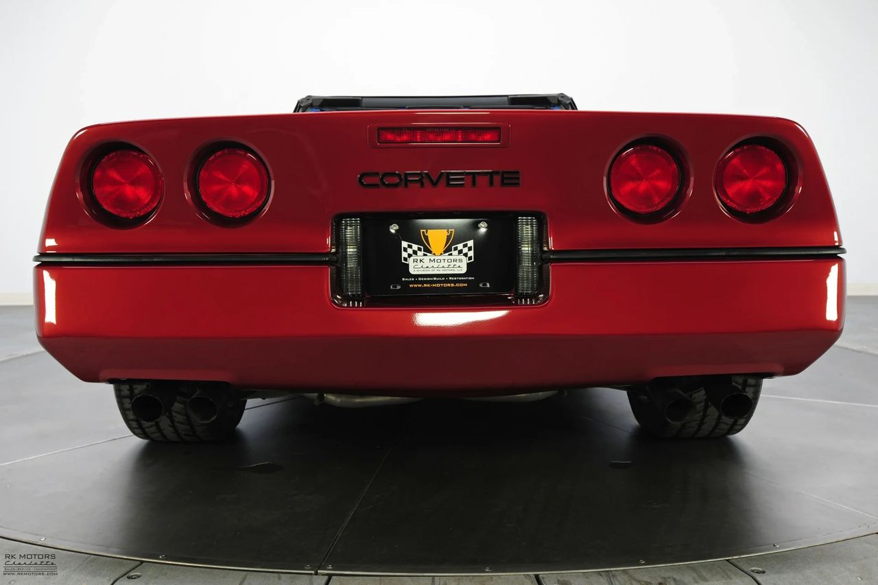A third tail light was introduced on all 1986 Corvette models.  On the coupes, it was mounted about the rear hatch glass.  On convertibles (as seen here) it was integrated into the convertible's rear fascia/bumper assembly.  (Image courtesy of RK Motors.)