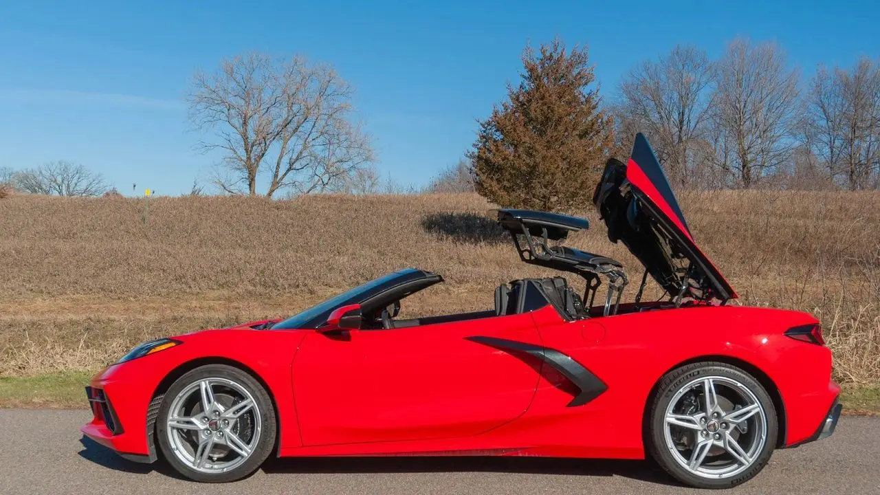 Convertible production kicked off in early August 2020 at Bowling Green, just weeks after the COVID shutdowns had idled the plant and scrambled supplier schedules. Chevrolet had to re-qualify parts flow, retrain crews, and add extra quality checks for the new six-motor power hardtop—its hinges, seals, and sensors—while still catching up on coupe demand. The C8 became the first Corvette with a factory power-folding hardtop, dropping in about 16 seconds at up to 30 mph, with an independent rear glass and the two-trunk layout intact (frunk + rear for real luggage). The mechanism adds roughly 100 pounds, but the mid-engine structure preserves rigidity and keeps performance within a blink of the coupe—trading little speed for a lot of everyday usability. The bet paid off: by the next model year, the hardtop convertible would make up about 42% of C8 production, proving the packaging was exactly what buyers wanted.