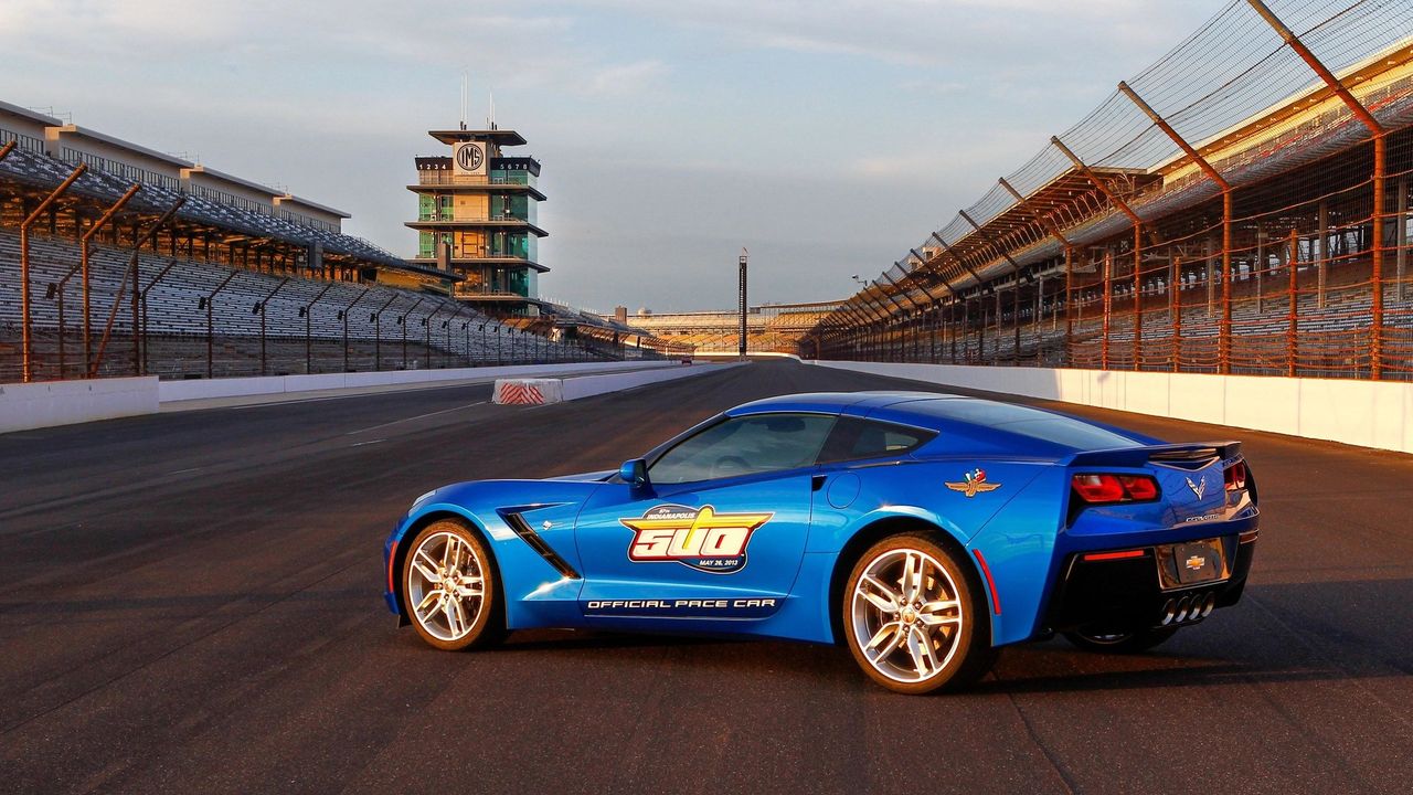 A C7 Stingray on the Yard of Bricks: the 2014-model Corvette that paced the 97th Indianapolis 500 (May 26, 2013), wearing its “Official Pace Car” livery in Laguna Blue. By this point, Corvette had led the Indy 500 field 12 times—a record among production cars—stretching from the first in 1978 to this C7 outing. A fitting debut for the reborn Stingray at the Speedway. (Image courtesy of GM Media LLC)