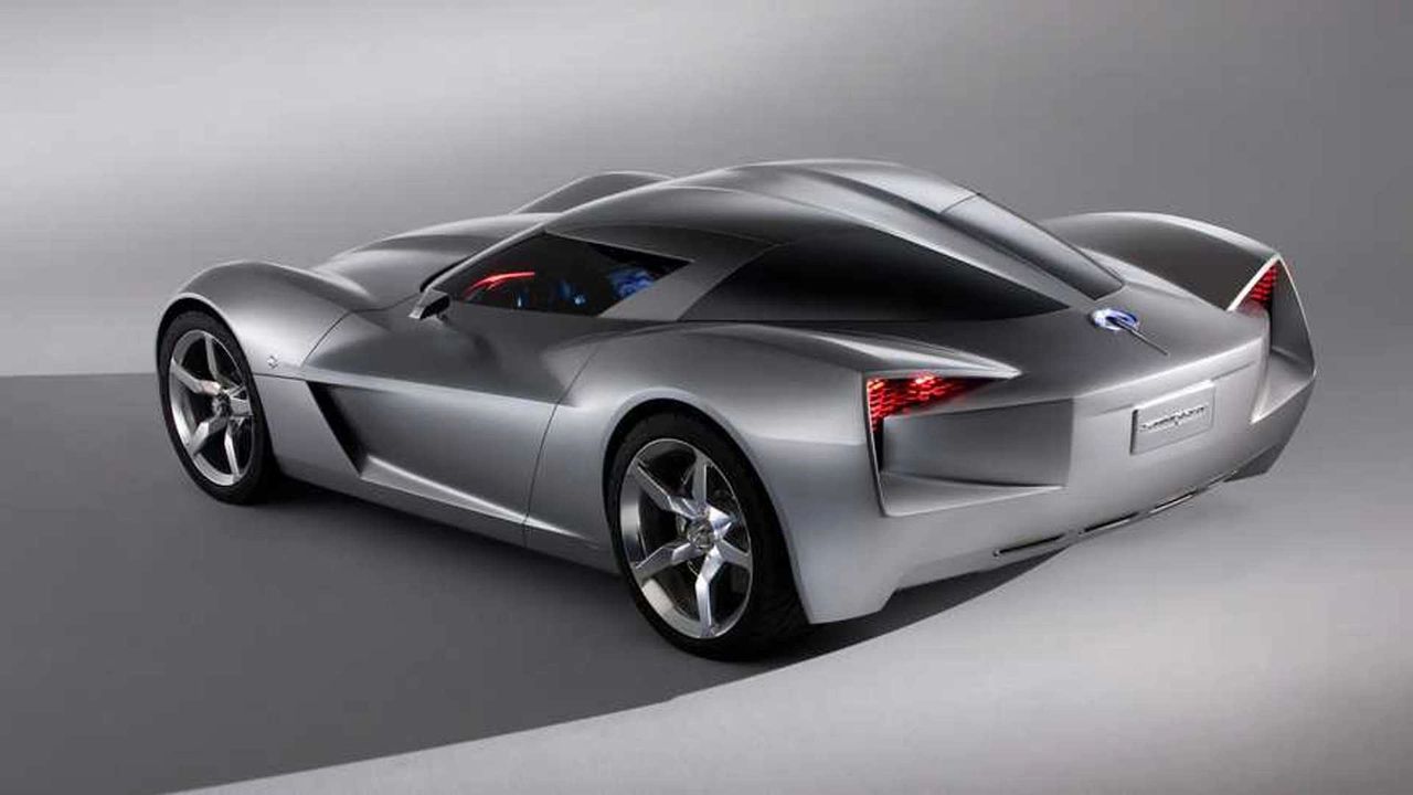 The 2009 Stingray Concept previewed the C7’s attitude: sharp creases over big rear haunches, a strong center spine, and a fastback canopy that pinched into a tapered tail. Its faceted surfacing and “boomerang” lamp graphics nudged Corvette away from round themes, paving the way for the C7’s angular, dual-element taillamps. You can also see the concept’s aero-minded cutlines and extractor motifs echoed in the C7’s functional hood and quarter vents. Even the centered quad-exhaust emphasis reads as an evolution of the concept’s tightly grouped rear treatment—more production-real, but the same modern, technical vibe. (Image courtesy of GM Media LLC)