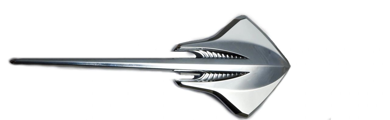 C7 Corvette “Stingray” fender emblem — a modern, chrome reinterpretation of the classic fish motif, with blade-like surfacing and gill details that echo the car’s sharp lines.