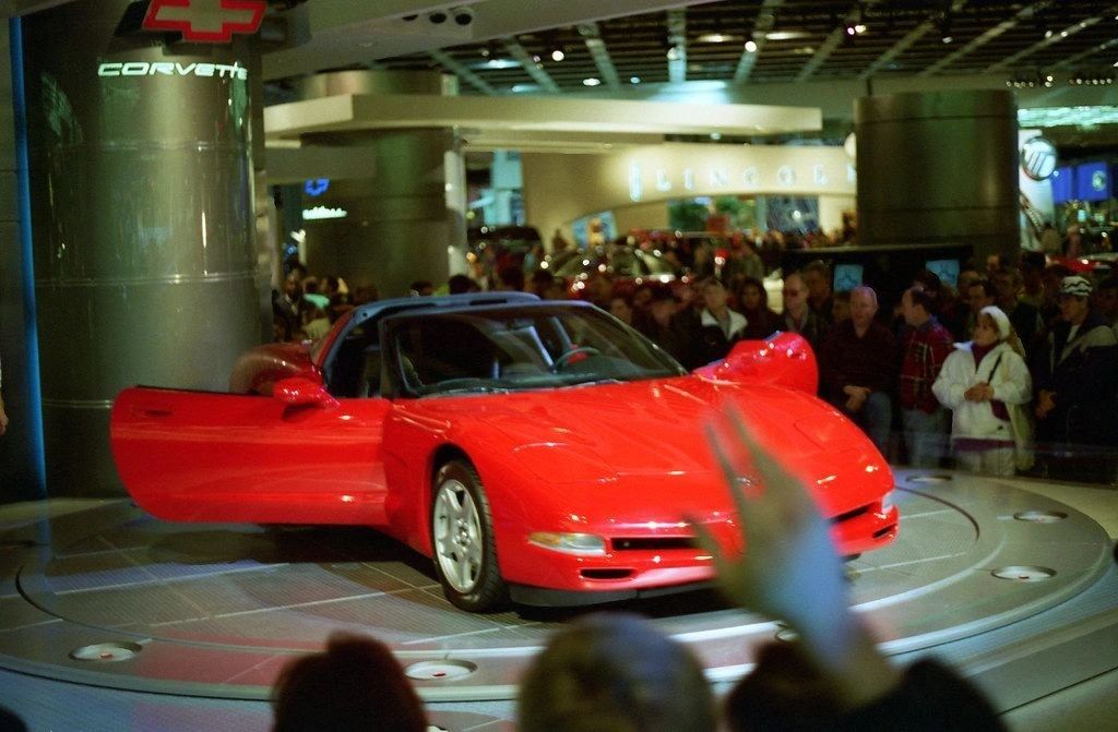 Chevrolet unveiled the all-new 1997 Corvette (C5) on January 6, 1997 at the North American International Auto Show in Detroit. The clean-sheet car debuted a stiffer hydroformed frame, a rear-mounted transaxle for better cabin space and near-perfect balance, and a sleek 0.29 drag coefficient. Power came from the new aluminum 5.7-liter LS1 rated at 345 hp and 350 lb-ft, paired with either a 4L60-E automatic or Borg-Warner T-56 six-speed manual. Tech highlights at the reveal included Goodyear Eagle F1 GS EMT run-flats, optional Selective Real-Time Damping (F45), and the Z51 performance package. Chevrolet said retail sales would begin March 7, 1997, with a $38,060 MSRP—just $270 more than 1996 despite about $1,200 in added standard equipment.