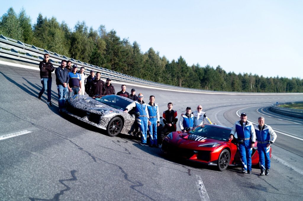 The team behind the 2025 Corvette ZR1 along with two early ZR1 Corvettes used for setting the car's current top-speed record.