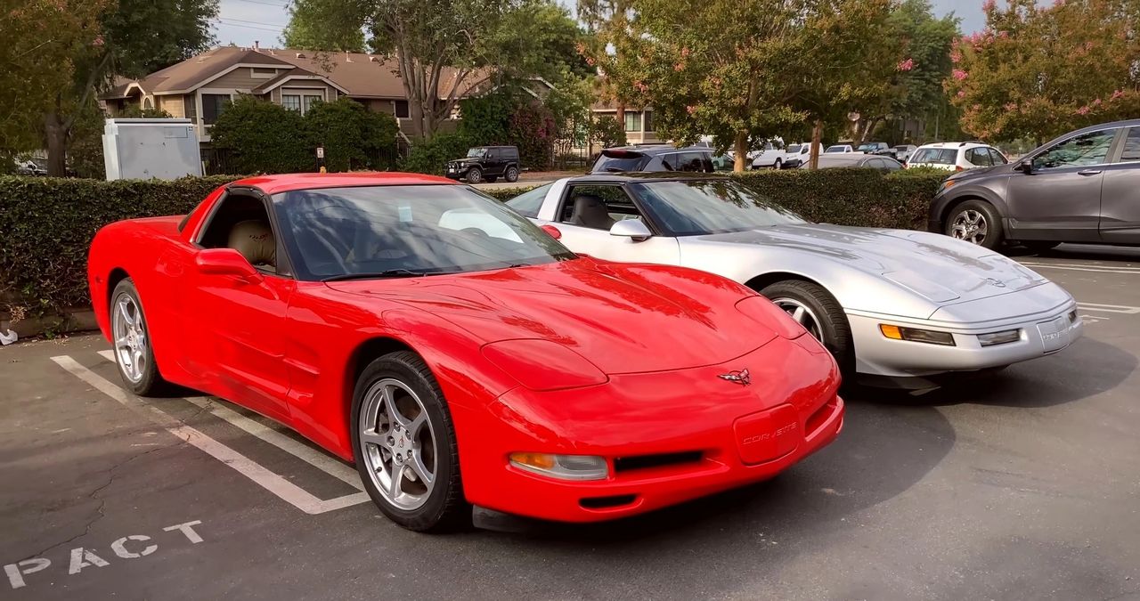 Silver to red is more than color—it’s architecture handing off to architecture. The C4 in back is the last of the front-engine/front-transmission Corvettes, honed to a fine edge with the LT4, FX3/F45 damping, and that unmistakably talkative C4 steering. The C5 up front arrives with the clean-sheet answers: hydroformed perimeter rails, a torque-tube and rear transaxle for balance, and the all-aluminum LS1 (345 hp) that reset how a small-block felt above 5,000 rpm. Drag drops, structure tightens, noise calms, and the car stops asking you to work around it and starts working with you. Same Bowling Green lineage, same core voice—just a baton passed from “sharp and analog” to “stiff, composed, and relentlessly usable.”
