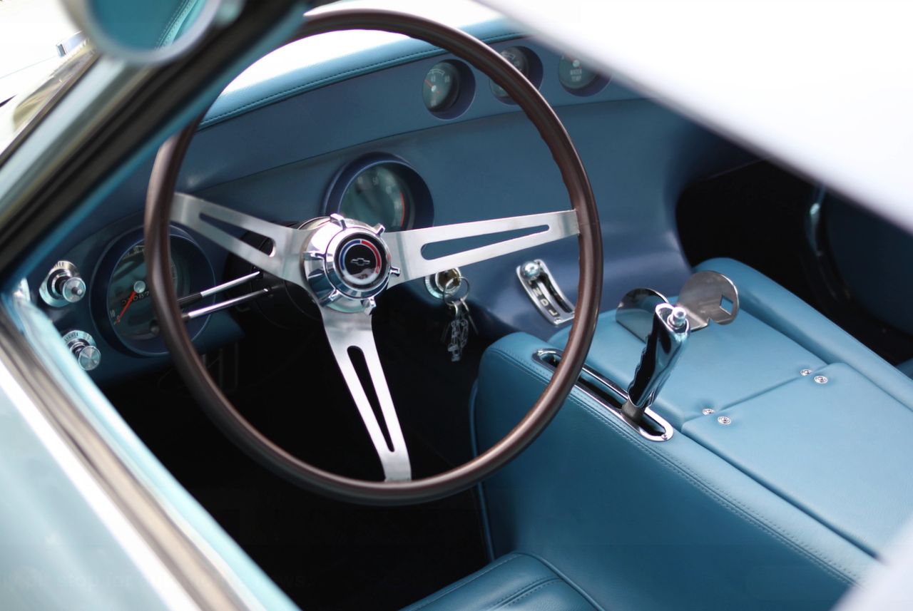 Inside the XP-819, the driver’s environment was engineered as carefully as the chassis. Because the seat was fixed into the chassis tub, the pedal box itself was mounted on tracks and could be moved fore and aft, allowing drivers of different sizes to dial in their reach without disturbing the carefully reclined driving position. Deep, molded side bolsters kept the driver locked in place, turning the entire seat shell into a kind of sculpted safety cell rather than a loose cushion bolted to the floor. The compact, deep-dish steering wheel, close-set shifter, and clustered gauges were all positioned so the driver could work the car with minimal arm and hand movement—very much a race-car approach to ergonomics. Altogether, the XP-819 cockpit was a rolling experiment in driver fit and accessibility, wrapping the controls around the pilot in a way production Corvettes wouldn’t fully embrace for decades. Inside the XP-819, the driver’s environment was engineered as carefully as the chassis. Because the seat was fixed into the chassis tub, the pedal box itself was mounted on tracks and could be moved fore and aft, allowing drivers of different sizes to dial in their reach without disturbing the carefully reclined driving position. Deep, molded side bolsters kept the driver locked in place, turning the entire seat shell into a kind of sculpted safety cell rather than a loose cushion bolted to the floor. The compact, deep-dish steering wheel, close-set shifter, and clustered gauges were all positioned so the driver could work the car with minimal arm and hand movement—very much a race-car approach to ergonomics. Altogether, the XP-819 cockpit was a rolling experiment in driver fit and accessibility, wrapping the controls around the pilot in a way production Corvettes wouldn’t fully embrace for decades.