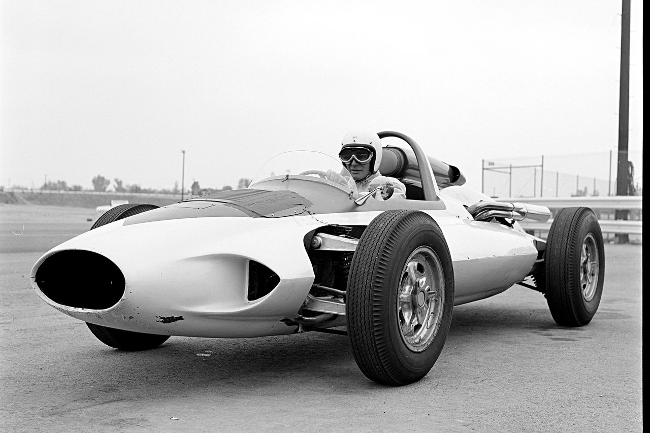 At Continental Divide Raceways in Castle Rock, Colorado, Zora Arkus-Duntov used CERV I not just on proving grounds but in front of crowds, demonstrating its capabilities in a dynamic setting. The track—opened in 1959 at altitude just south of Denver—was a natural fit for Chevrolet’s “engineer as showman,” giving Duntov the chance to showcase the car’s mid-engine balance, quick steering, and independent suspension in a live environment. Period photos, like this one, show Zora at the wheel in full gear, the CERV I’s minimalist fiberglass body and exposed suspension arms underscoring its role as a research mule rather than a polished race car. Appearances like this helped cement Duntov’s reputation as both visionary and evangelist—willing to put prototypes through their paces on public display to build excitement around Corvette engineering. (Image courtesy of GM Media LLC)