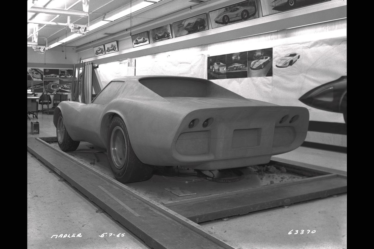 In this studio shot, the XP-819’s radical shape is still literally being carved out of clay, capturing the moment when Chevrolet’s designers were pushing Corvette into unfamiliar, rear-engine territory. The wide, squared-off tail and deep inset rear panel reflect an ongoing tug-of-war between pure aero experimentation and recognizable Corvette DNA. Clay modeling let the team constantly refine proportions, surface transitions, and lighting details in full scale before committing anything to metal or fiberglass. What you’re seeing here is the XP-819 in mid-evolution—part science experiment, part design laboratory for ideas that would echo through later Corvette programs. (Image courtesy of GM Media LLC) In this studio shot, the XP-819’s radical shape is still literally being carved out of clay, capturing the moment when Chevrolet’s designers were pushing Corvette into unfamiliar, rear-engine territory. The wide, squared-off tail and deep inset rear panel reflect an ongoing tug-of-war between pure aero experimentation and recognizable Corvette DNA. Clay modeling let the team constantly refine proportions, surface transitions, and lighting details in full scale before committing anything to metal or fiberglass. What you’re seeing here is the XP-819 in mid-evolution—part science experiment, part design laboratory for ideas that would echo through later Corvette programs. (Image courtesy of GM Media LLC)