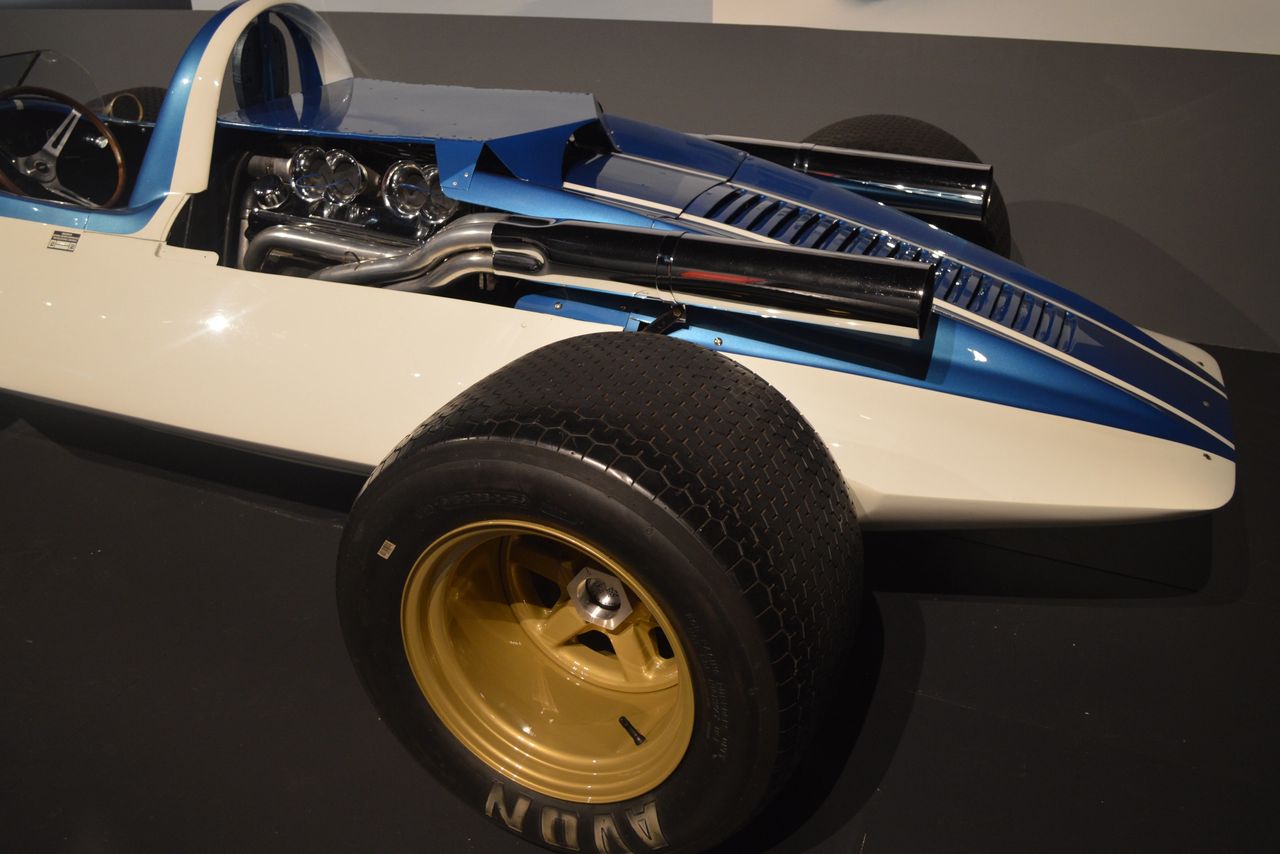 Think of CERV I as a rolling dyno. Over its career the spaceframe hosted seven small-block V-8 iterations—opening with Rochester-injected 283s and hot 327s, then graduating to an all-aluminum 377 set low in the chassis with a dry sump and Hilborn eight-stack injection. The team treated swaps like lab trials: heads, cams, induction, and ratios in the Halibrand quick-change were cycled to isolate what made speed and reliability. Ever curious, Duntov even plumbed a TRW turbocharger; at roughly 17 psi the mule was credited with about 500 hp. With tall gearing and Shinoda-massaged bodywork, the package produced a measured 206 mph at Milford—proof that every engine configuration wasn’t just a power play, but a data point that shaped future Corvette road and race programs. (Image courtesy of Joe Kolecki/Kolecki Photography)