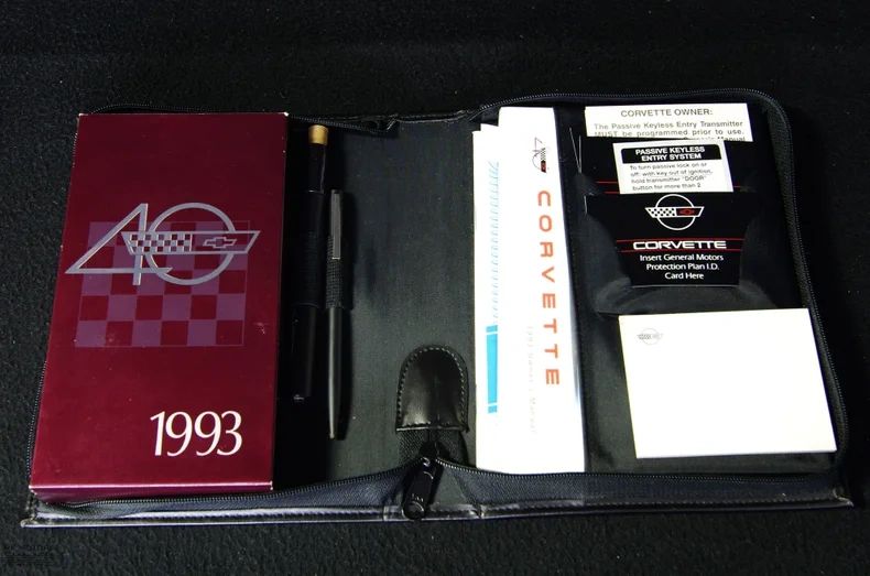 Tucked neatly inside every 1993 Corvette owner’s portfolio was more than just the usual owner’s manual and warranty paperwork—it included a special VHS cassette commemorating the Corvette’s 40th Anniversary. Finished in the same Ruby Red theme that defined the milestone model, this tape wasn’t just packaging; it was a window into Corvette heritage. Owners could pop it into their VCR and relive four decades of America’s Sports Car—celebrating its racing triumphs, engineering innovations, and cultural impact. Today, that anniversary cassette has become one of the most nostalgic pieces of Corvette memorabilia, a reminder of when Chevrolet blended analog keepsakes with digital excitement to mark a milestone year.