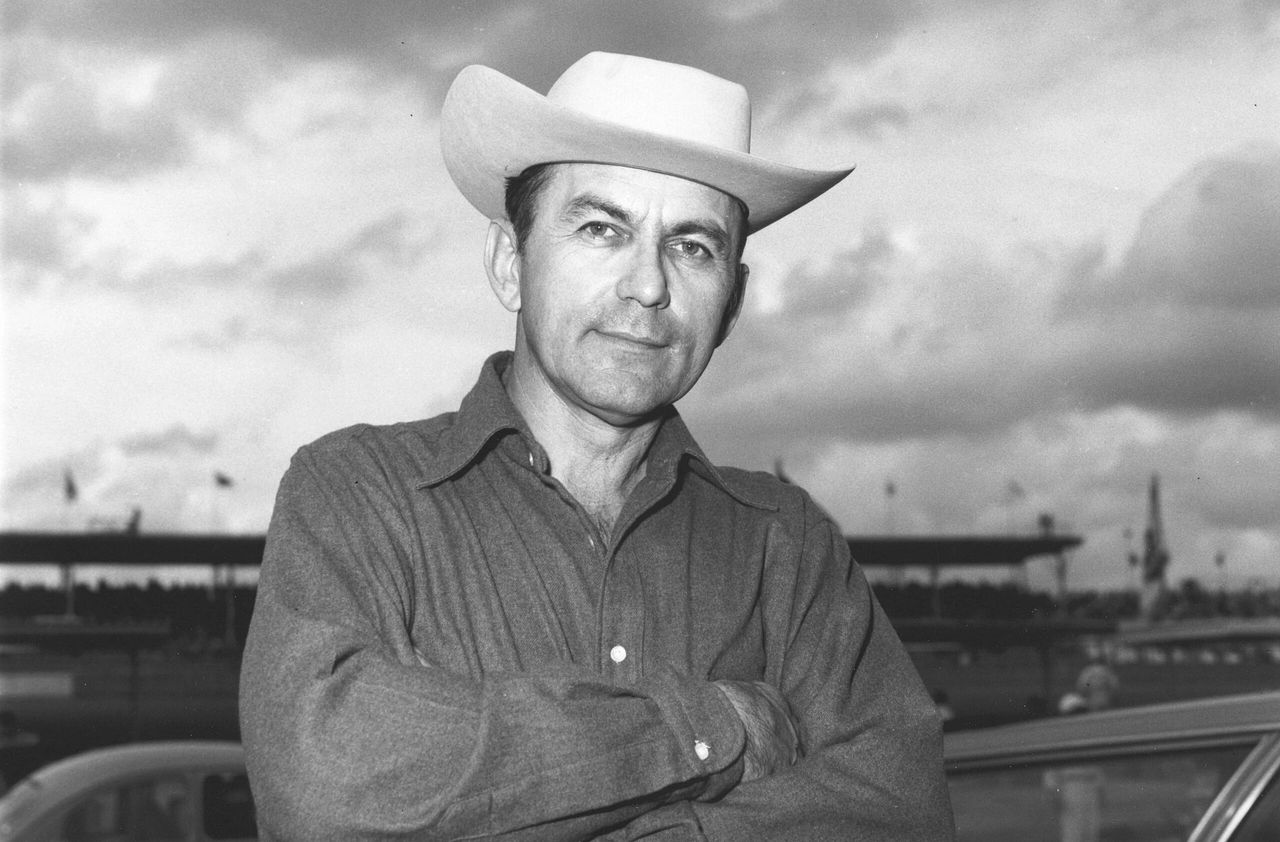 Henry “Smokey” Yunick was one of American motorsport’s most ingenious, irreverent, and relentlessly curious minds—a self-taught engineer whose Daytona Beach shop, “The Best Damn Garage in Town,” became legendary for producing machines that were fast, clever, and often just inside (or outside) the rulebook. A virtuoso fabricator and problem-solver, Yunick built winning cars for NASCAR, IndyCar, and international competition, earning a reputation for solutions so advanced that officials often didn’t discover them until years later. His connection to the XP-819 came after the prototype’s crash at Milford, when GM—via Bunkie Knudsen—quietly shipped the wreckage to Smokey under the pretense that he could salvage usable components for a rear-engine Indy project. Yunick dutifully sectioned the chassis, borrowed pieces for his own experimental work, and removed various systems for study, but when that effort stalled he simply tucked the remaining fragments into an old paint booth rather than destroying them. In doing so, Smokey inadvertently became the custodian of a lost chapter of Corvette history, preserving the only surviving pieces of XP-819 and enabling its eventual resurrection decades later. Henry “Smokey” Yunick was one of American motorsport’s most ingenious, irreverent, and relentlessly curious minds—a self-taught engineer whose Daytona Beach shop, “The Best Damn Garage in Town,” became legendary for producing machines that were fast, clever, and often just inside (or outside) the rulebook. A virtuoso fabricator and problem-solver, Yunick built winning cars for NASCAR, IndyCar, and international competition, earning a reputation for solutions so advanced that officials often didn’t discover them until years later. His connection to the XP-819 came after the prototype’s crash at Milford, when GM—via Bunkie Knudsen—quietly shipped the wreckage to Smokey under the pretense that he could salvage usable components for a rear-engine Indy project. Yunick dutifully sectioned the chassis, borrowed pieces for his own experimental work, and removed various systems for study, but when that effort stalled he simply tucked the remaining fragments into an old paint booth rather than destroying them. In doing so, Smokey inadvertently became the custodian of a lost chapter of Corvette history, preserving the only surviving pieces of XP-819 and enabling its eventual resurrection decades later.