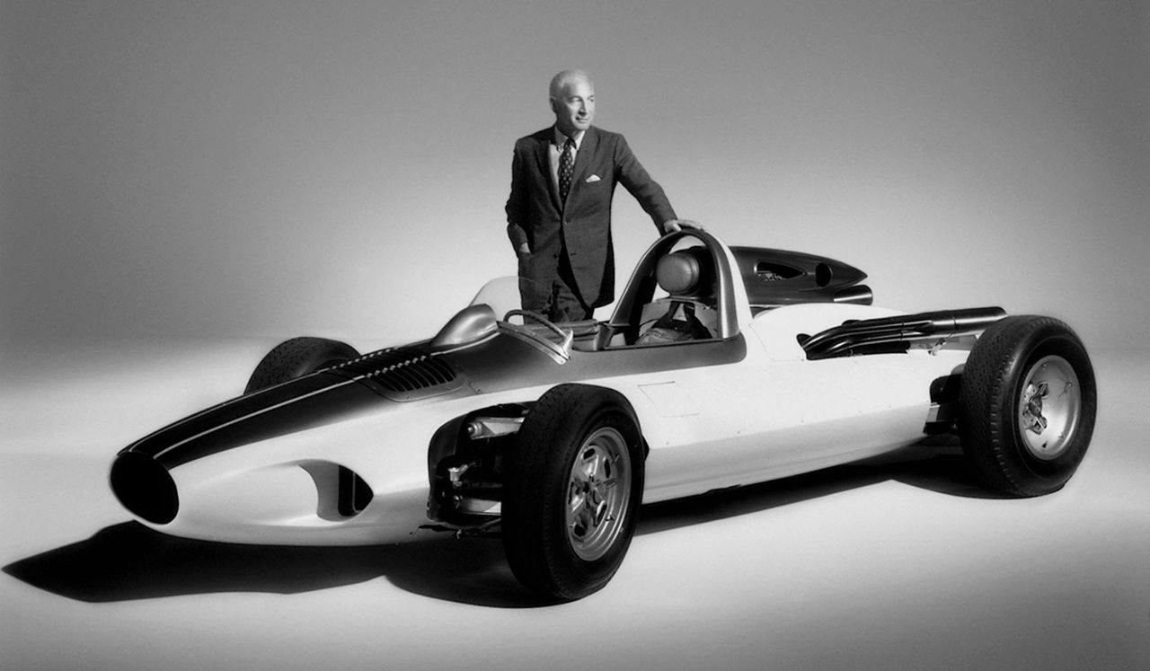 Zora Arkus-Duntov stands beside his 1960 CERV I—Chevrolet Engineering Research Vehicle—the single-seat, mid-engine test bed he created to prove what he’d been telling GM for years: that the future of true world-class performance required moving the Corvette’s powerplant behind the driver. Introduced in 1960 as a fully functional development mule, CERV I allowed Zora to study weight distribution, handling balance, and high-speed stability in ways the front-engine production Corvette of the era simply couldn’t match. Its featherweight chassis, rearward mass placement, and race-bred engineering became the evidence he needed to champion a mid- or rear-engine Corvette—a vision he fought for throughout his career and one GM wouldn’t realize until the C8 arrived six decades later. (Image courtesy of GM Media LLC) Zora Arkus-Duntov stands beside his 1960 CERV I—Chevrolet Engineering Research Vehicle—the single-seat, mid-engine test bed he created to prove what he’d been telling GM for years: that the future of true world-class performance required moving the Corvette’s powerplant behind the driver. Introduced in 1960 as a fully functional development mule, CERV I allowed Zora to study weight distribution, handling balance, and high-speed stability in ways the front-engine production Corvette of the era simply couldn’t match. Its featherweight chassis, rearward mass placement, and race-bred engineering became the evidence he needed to champion a mid- or rear-engine Corvette—a vision he fought for throughout his career and one GM wouldn’t realize until the C8 arrived six decades later. (Image courtesy of GM Media LLC)