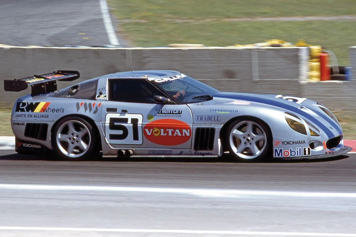Callaway’s SuperNatural LM GT2 Corvette—chassis 94-001 “Frieda”—wearing the #51 Voltan/RW Wheels livery at the 1994 24 Hours of Le Mans. Driven by Frank Jelinski, Boris Said, and Michel Maisonneuve, the aero-heavy Deutschman bodywork, big fixed lamps, and a 6.2-liter small-block made it a fan favorite, though the effort ended early after a DQ for outside assistance. The program returned stronger in 1995 with the sister #73 car, which famously finished 2nd in GT2 and 9th overall. (Image courtesy of Power Broker magazine)