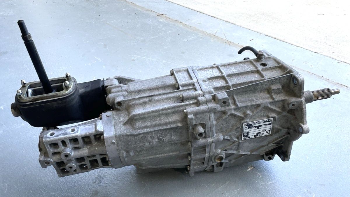 ZF S6-40 six-speed, as used in late C4 Corvettes (’89–’96)—the gearbox that finally gave the Corvette real ratio spacing and a deep highway overdrive. The ribbed aluminum case, side ID plate, and top-mount shifter tower are all telltales. It’s stout, famously smooth when healthy, and happy with the LT1/LT4’s torque. In short: the transmission that turned the C4 from quick to truly sorted.