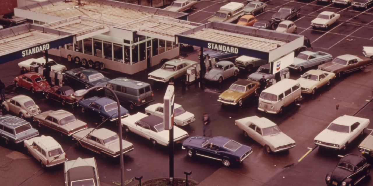The 1973 oil crisis, triggered when OAPEC nations cut production and placed an embargo on oil shipments, sent shockwaves through the U.S., sparking fuel shortages, economic inflation, and mile-long lines at gas stations like the one seen here. For the country, it meant rationing, reduced speed limits (55 mph), stalled travel, and a renewed urgency around fuel efficiency, forcing automakers and policymakers to rethink energy consumption nationwide. Inside GM, the crisis accelerated skepticism around the thirsty rotary program, even as engineers raced to production-optimize the 2-rotor Wankel for the Chevy Vega/Monza and concept projects like XP-987 GT. The inherent fuel-consumption drawbacks of the rotary—once tolerated in the name of innovation—suddenly felt politically and commercially dangerous. The turmoil shrank corporate appetite for risk, ultimately helping kill GM’s production-bound Wankel engine and steering Corvette development back toward more conventional powerplants. The 1973 oil crisis, triggered when OAPEC nations cut production and placed an embargo on oil shipments, sent shockwaves through the U.S., sparking fuel shortages, economic inflation, and mile-long lines at gas stations like the one seen here. For the country, it meant rationing, reduced speed limits (55 mph), stalled travel, and a renewed urgency around fuel efficiency, forcing automakers and policymakers to rethink energy consumption nationwide. Inside GM, the crisis accelerated skepticism around the thirsty rotary program, even as engineers raced to production-optimize the 2-rotor Wankel for the Chevy Vega/Monza and concept projects like XP-987 GT. The inherent fuel-consumption drawbacks of the rotary—once tolerated in the name of innovation—suddenly felt politically and commercially dangerous. The turmoil shrank corporate appetite for risk, ultimately helping kill GM’s production-bound Wankel engine and steering Corvette development back toward more conventional powerplants.