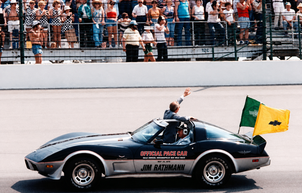 1960 Indy 500 winner Jim Rathmann pilots the black-over-silver ’78 Corvette Pace Car past the grandstands during pre-race ceremonies, IMS flags snapping in the breeze. The moment was Corvette’s first time on point at the 500, a sight that preceded Al Unser Sr.’s third win—and a nationwide rush for showroom replicas.