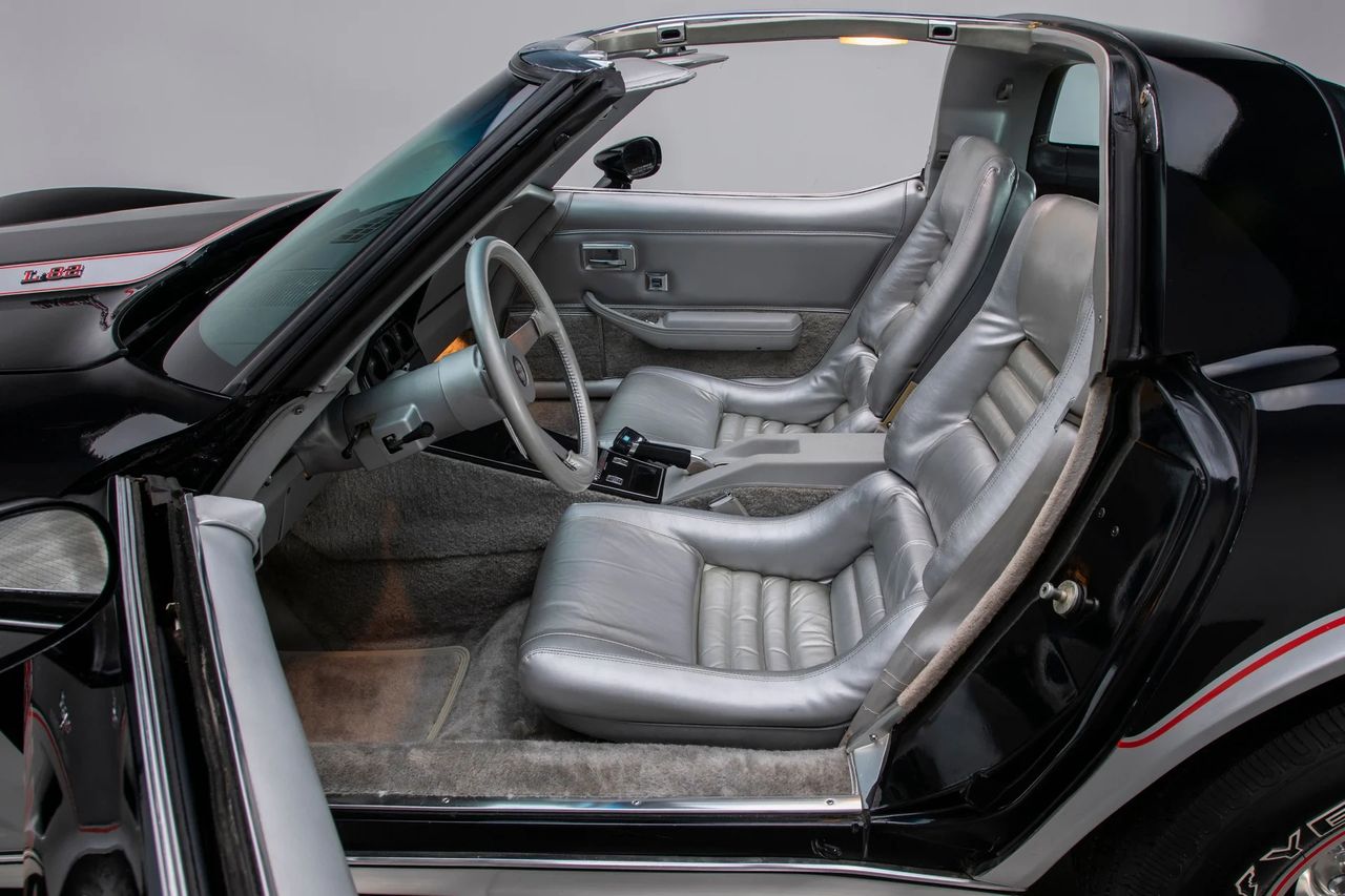 The 1978 Pace Car debuted Corvette’s new thin-shell sport seat, a lighter, slimmer bucket with deeper thigh bolsters, a firmer multi-pad lumbar section, and a revised recliner/track geometry that set the driver lower and more centered behind the wheel. The sculpted shells free up cabin space and tighten lateral support without big-blocky cushions, while the horizontal pleats spread pressure for long-stint comfort. Introduced here a year early—before rolling out line-wide for ’79—these seats signaled that the Pace Car wasn’t just a livery; it was the launch point for a better-ergonomics era in the C3. (Image courtesy of RK Motors) The 1978 Pace Car debuted Corvette’s new thin-shell sport seat, a lighter, slimmer bucket with deeper thigh bolsters, a firmer multi-pad lumbar section, and a revised recliner/track geometry that set the driver lower and more centered behind the wheel. The sculpted shells free up cabin space and tighten lateral support without big-blocky cushions, while the horizontal pleats spread pressure for long-stint comfort. Introduced here a year early—before rolling out line-wide for ’79—these seats signaled that the Pace Car wasn’t just a livery; it was the launch point for a better-ergonomics era in the C3. (Image courtesy of RK Motors)