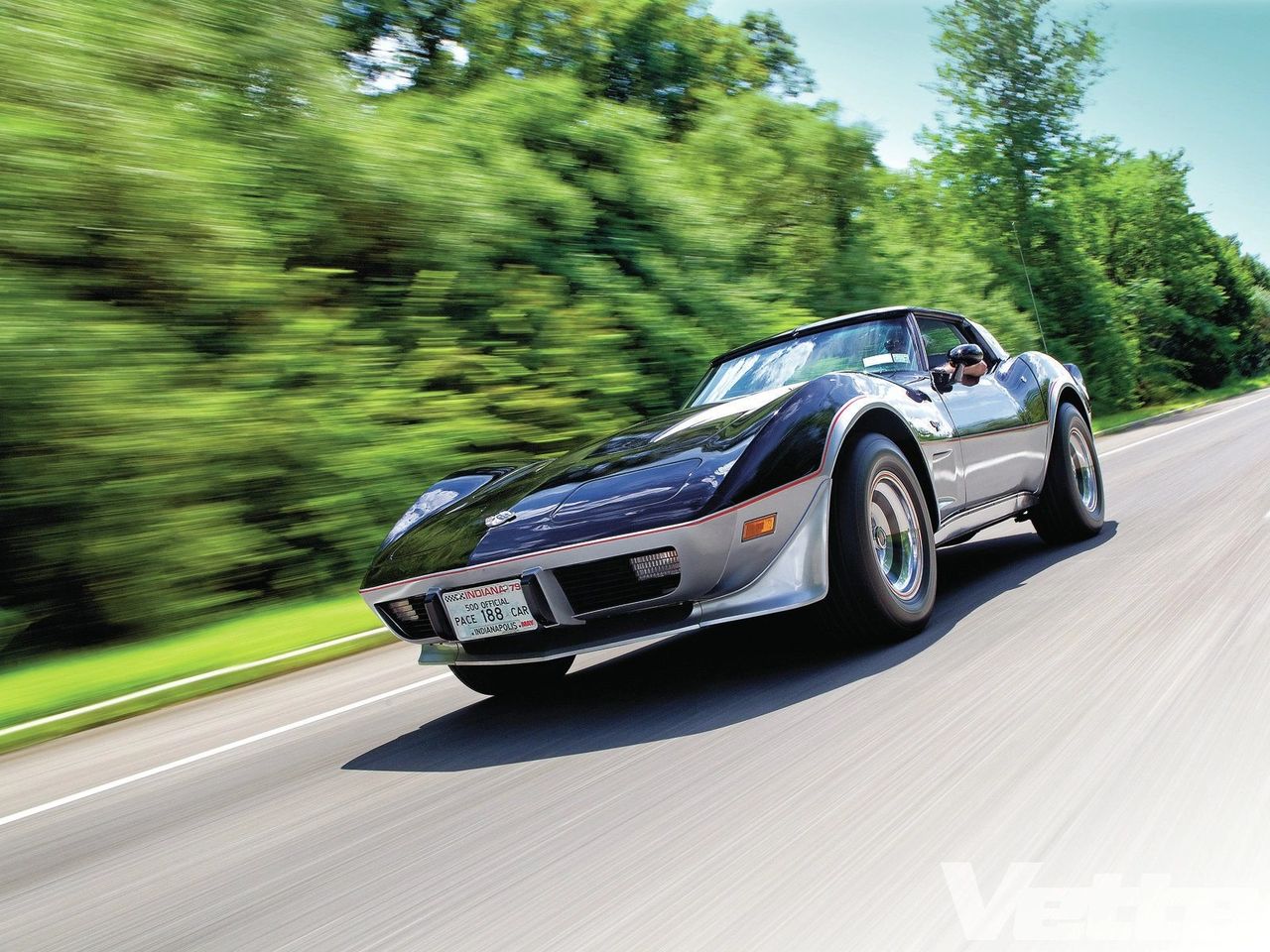 At interstate pace, the Pace Car settles into a long-legged stride: the L82 hums just off the cam beneath the glass T-tops, and the chassis tracks arrow-straight with a light touch on the wheel. A small brush of throttle dispatches traffic; a clean downshift brings an eager surge without strain. Wind and road noise stay measured, the fastback glass opens the view, and the thin-shell seats hold the driver low and centered. Miles unspool with relaxed GT rhythm—composed, confident, and just a bit theatrical as the red pinstripe flashes in roadside reflections. (Image courtesy of Vette Magazine) At interstate pace, the Pace Car settles into a long-legged stride: the L82 hums just off the cam beneath the glass T-tops, and the chassis tracks arrow-straight with a light touch on the wheel. A small brush of throttle dispatches traffic; a clean downshift brings an eager surge without strain. Wind and road noise stay measured, the fastback glass opens the view, and the thin-shell seats hold the driver low and centered. Miles unspool with relaxed GT rhythm—composed, confident, and just a bit theatrical as the red pinstripe flashes in roadside reflections. (Image courtesy of Vette Magazine)