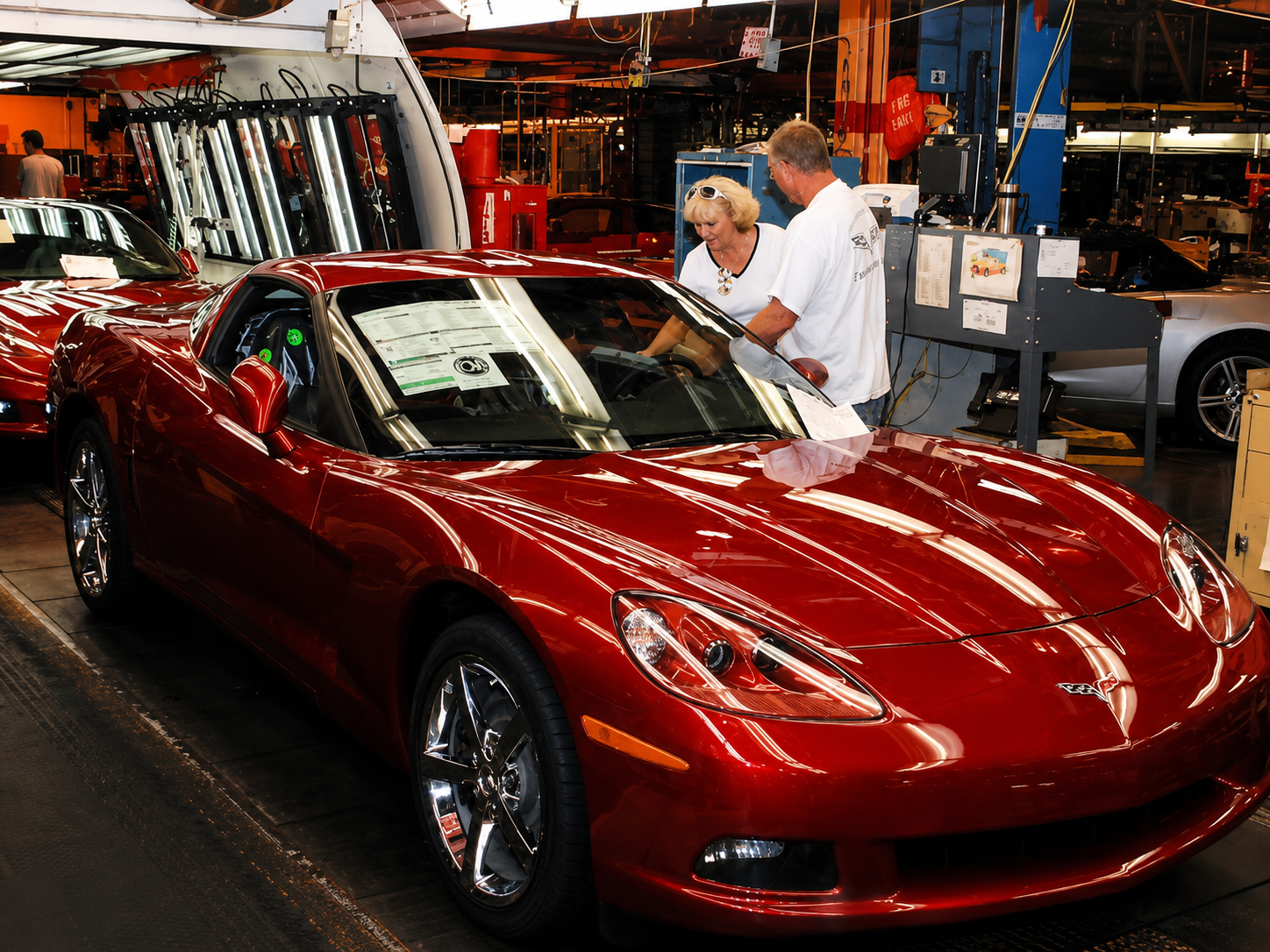 This image captures the 2005 Corvette at the point where Chevrolet’s sales success, Bowling Green craftsmanship, and unusually personal ownership experience came together. The first-year C6 generated 37,372 sales, including 26,728 coupes, as buyers responded to its stronger performance, cleaner styling, expanded equipment, and remarkable value. The visitors examining this Precision Red coupe inside the Bowling Green Assembly Plant suggest that it may have been connected to the R8C Museum Delivery program, although the photograph alone cannot confirm that. R8C allowed customers to order their Corvette through a Chevrolet dealer but take delivery at the nearby National Corvette Museum, where the experience included a personalized vehicle presentation, detailed orientation, and a closer connection to the people and place responsible for building the car. Just 831 buyers selected R8C for 2005—approximately 2.2 percent of production—making scenes like this representative of an increasingly important part of the Corvette sales experience: purchasing the car was not simply a transaction, but an event owners wanted to remember.