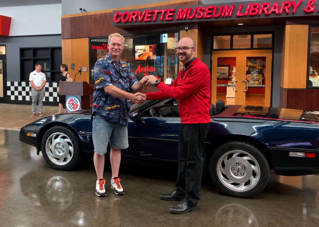 Lars Wallace Jr. hands the keys to the family’s Dark Blue Metallic 1988 Corvette convertible to National Corvette Museum Director of Collections and Curator Derek E. Moore during the car’s June 30, 2020 donation ceremony at the Museum.