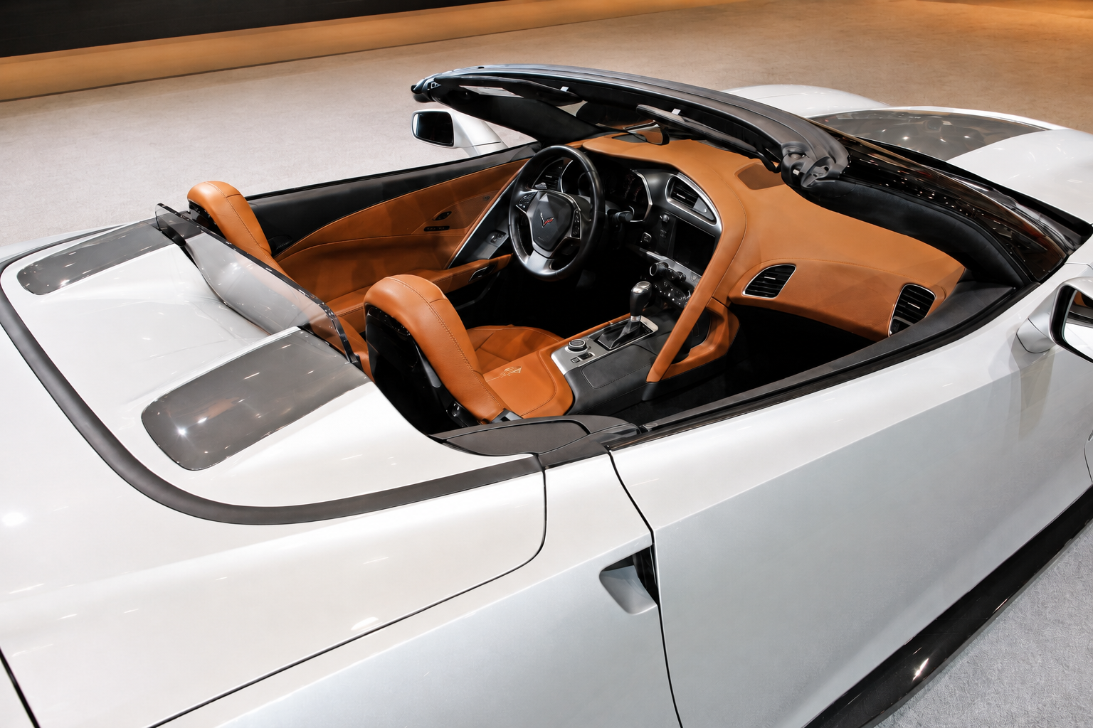 2015 Chevrolet Corvette Stingray Atlantic concept convertible interior featuring rich brown leather and suede appointments, premium carpeting, Stingray detailing, and an open-air grand-touring design.