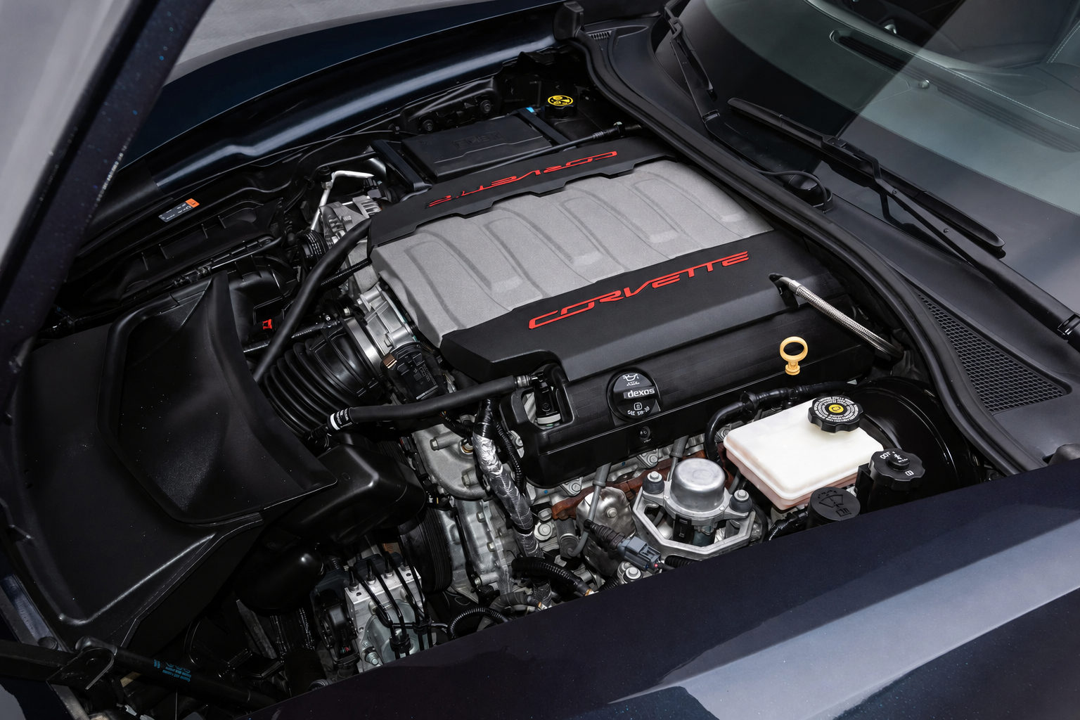 2015 Chevrolet Corvette Stingray 6.2-liter LT1 V-8 engine, featuring the factory fuel-rail covers with red CORVETTE lettering.