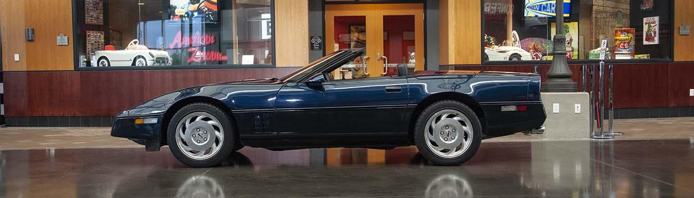 Dark Blue Metallic 1988 Chevrolet Corvette convertible displayed at the National Corvette Museum, one of five Corvettes used by Chevrolet to promote its Miss America sponsorship during the 1988 auto-show season.