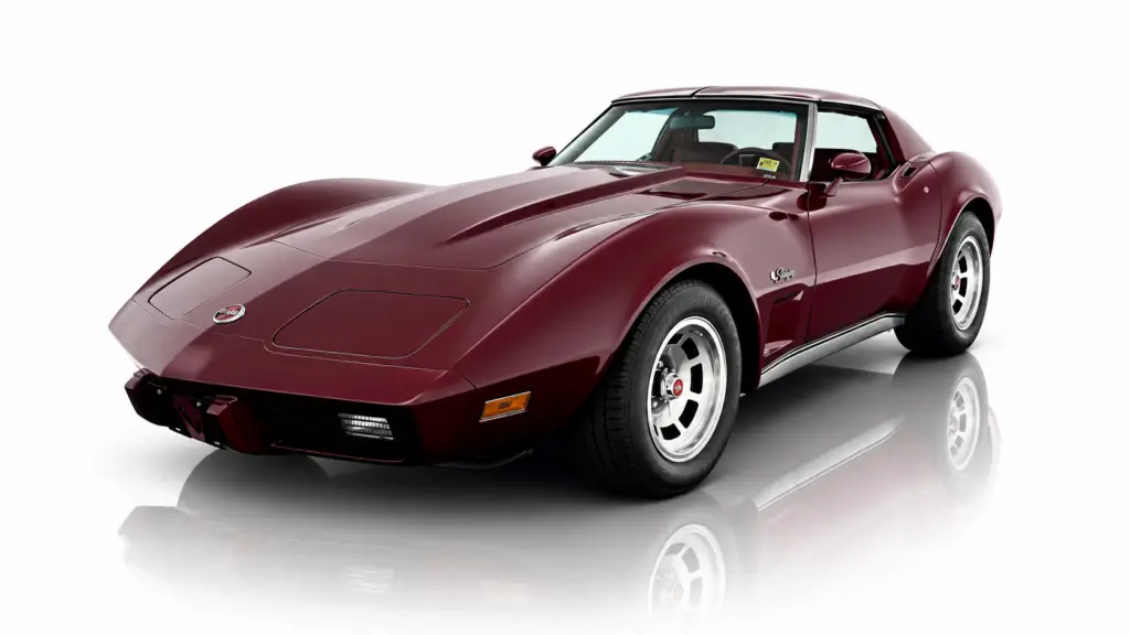 Front driver side 3/4 view of 1976 Corvette coupe in maroon paint.