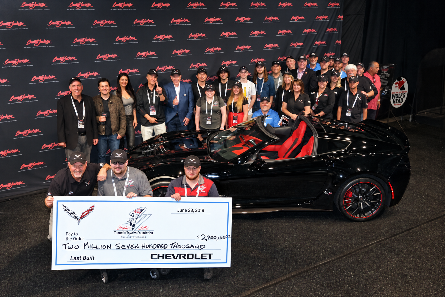 Chevrolet, Barrett-Jackson and Tunnel to Towers representatives pose with the final C7 Corvette and a ceremonial $2.7 million check benefiting the Stephen Siller Tunnel to Towers Foundation in June 2019.