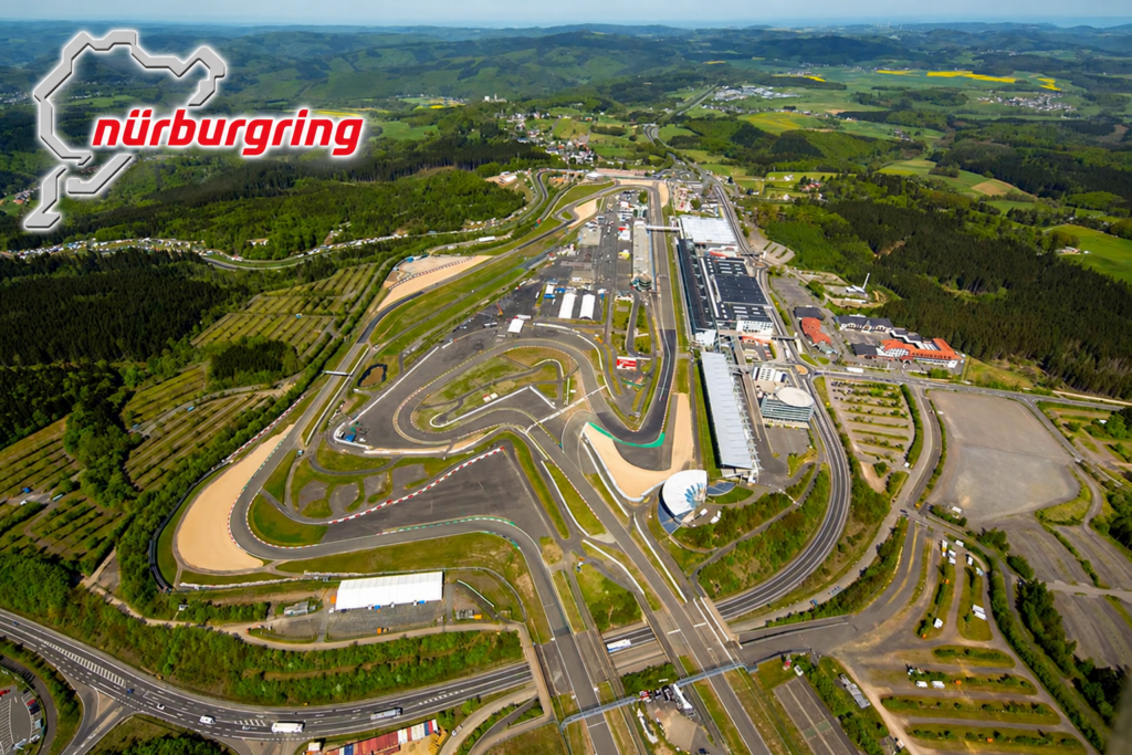 Aerial view of the Nürburgring complex and surrounding German countryside, with a Nürburgring logo and track outline overlaid in the upper left corner. The image serves as an introduction to the legendary circuit where the 2006 Corvette Z06 underwent important high-performance testing and development.