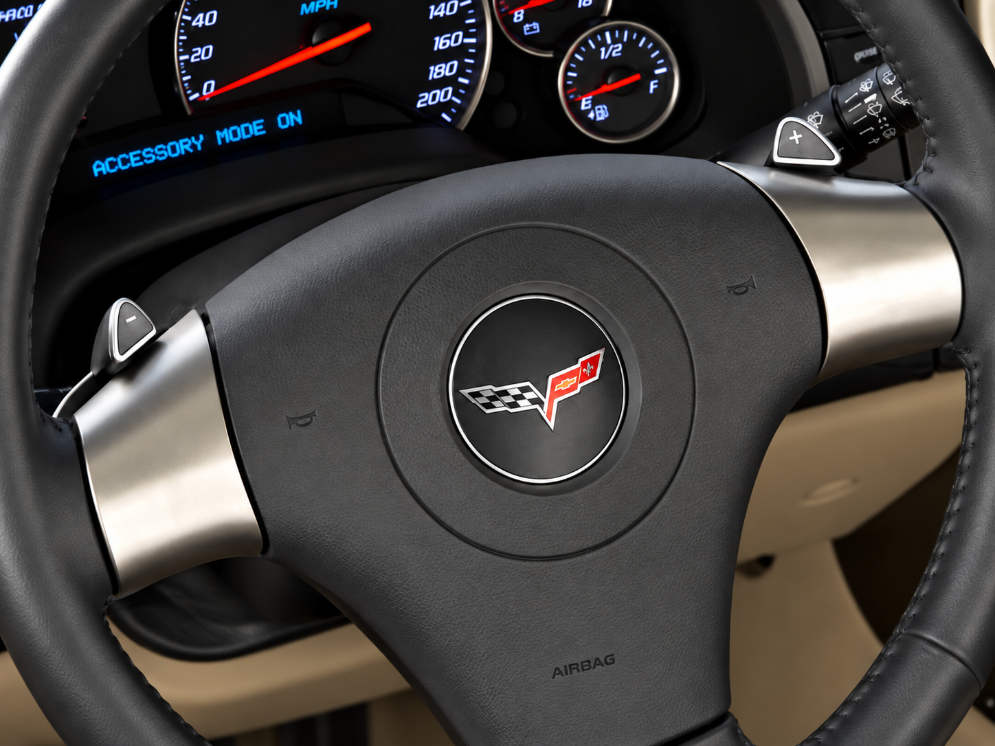 For 2006, Chevrolet introduced steering-wheel-mounted paddle shifters to the Corvette for the first time, bringing a new level of driver engagement to the C6’s optional Hydra-Matic 6L80 six-speed automatic transmission. Known as TAPshift (Touch Activated Power), the system allowed drivers to select gears manually without removing their hands from the steering wheel or operating a clutch pedal. The compact paddles, positioned behind the steering wheel spokes, provided immediate control over gear selection, particularly during spirited driving, cornering, and acceleration. Working alongside the transmission’s electronically controlled shift programming, TAPshift offered an engaging alternative to traditional automatic operation, combining the convenience of an automatic with some of the control enthusiasts typically associated with a manual gearbox. It was another important step in Chevrolet’s effort to make the sixth-generation Corvette both technologically sophisticated and genuinely rewarding to drive.